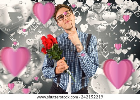 Geeky hipster holding a bunch of roses against grey valentines heart pattern