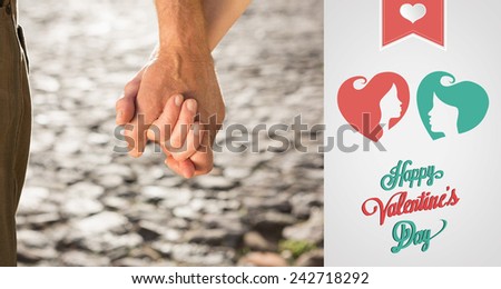 Happy senior couple holding hands against cute valentines message