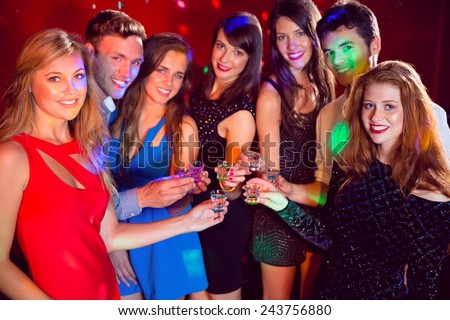 Happy friends on a night out together at the nightclub
