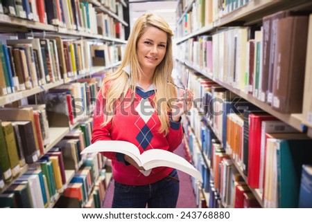 Mature student studying in the library at the university
