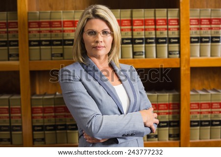 Lawyer looking at camera in law library at the university