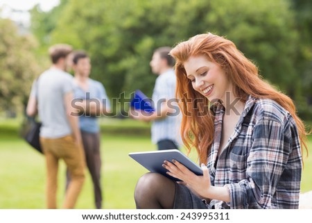 Pretty student studying outside on campus at the university
