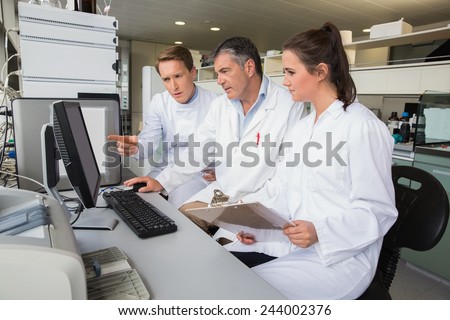 Team of scientists working together at the laboratory