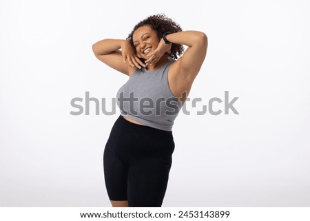 Similar – Image, Stock Photo Happy plus size curly young woman smiling to camera while using a laptop to prepare,and do work online at home, remote tasking. Modern city flat. Getting the bills paid. Entrepreneur freelancer women