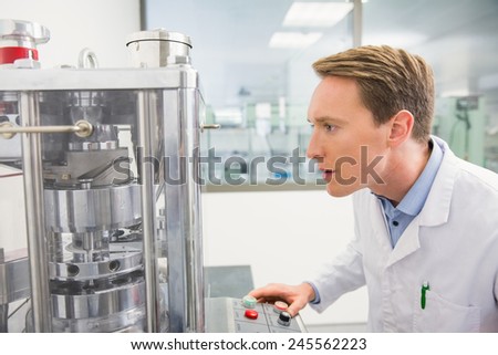 Focused pharmacist using advanced technology at the hospital pharmacy