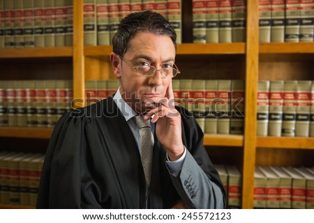 Lawyer looking at camera in the law library at the university