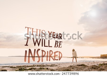 Woman in sweater walking on beach against i will be inspired