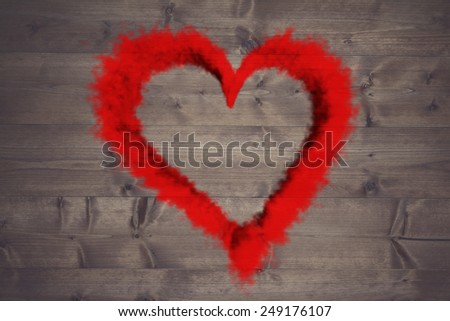 Red smoke heart against bleached wooden planks background