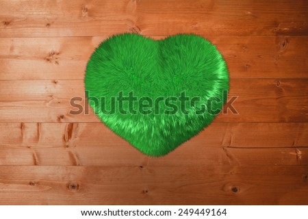 Green heart against overhead of wooden planks