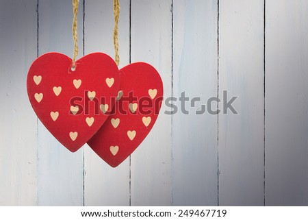 Cute heart decorations against painted blue wooden planks