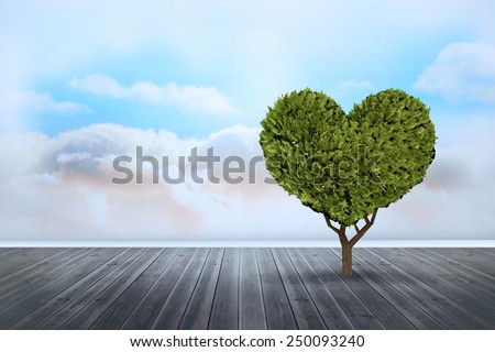 Heart shaped plant against clouds in a room