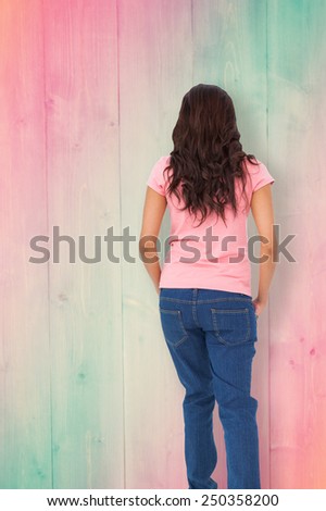 Pretty brunette stepping against pink and green planks