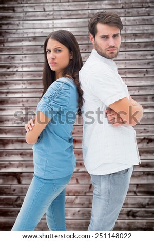 Upset couple not talking to each other after fight against wooden planks