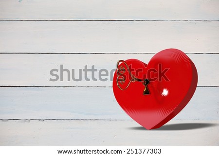 Love heart lock against painted blue wooden planks