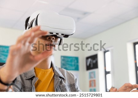 Image, Stock Photo Boy with virtual reality glasses on colorful background. Future technology, VR concept