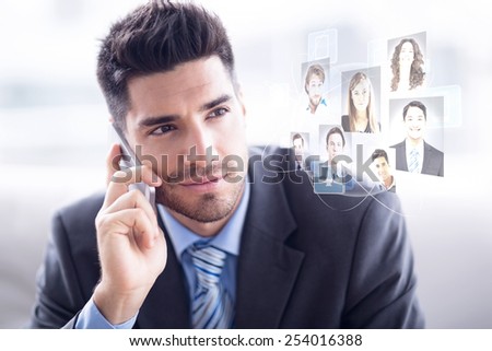 Handsome businessman sitting on sofa making a call against profile pictures