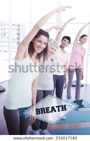 The word breath and class stretching hands at yoga class against badge