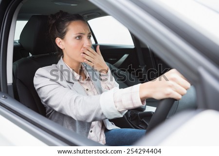 Nervous businesswoman crashing her car during her trip