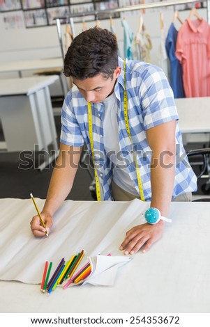 Fashion student drawing patterns at the college