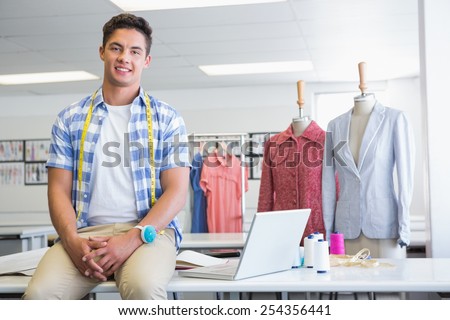 Fashion student with meter near models at the college
