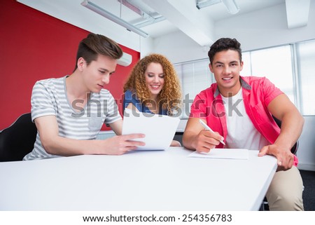 Students working together in class at the college
