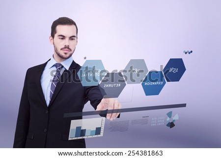 Cheerful businessman pointing at camera against grey vignette
