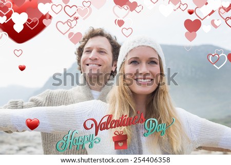 Casual young couple stretching hands out outdoors against cute valentines message