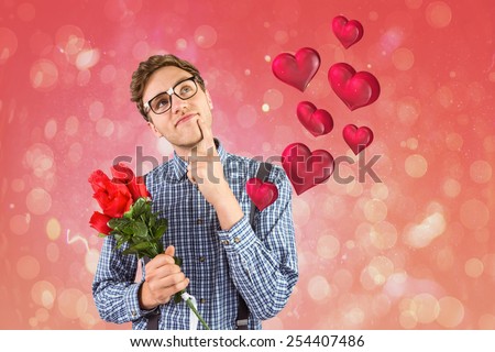 Geeky hipster holding a bunch of roses against red abstract light spot design