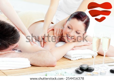 Positive young couple enjoying a back massage against heart