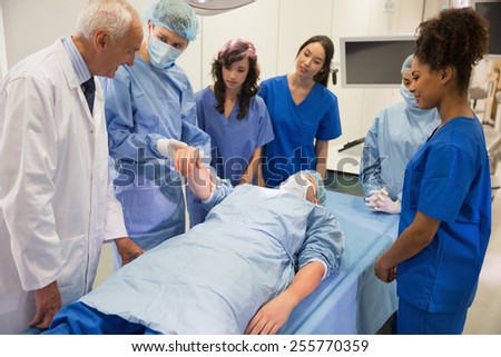 Medical students learning from professor at the university