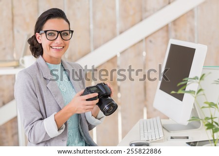 Stylish brunette working from home in her home office