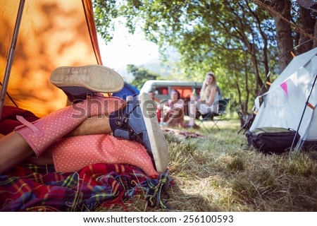 Young couple making out in tent at a music festival
