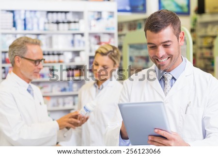 Pharmacist using the tablet at the hospital pharmacy
