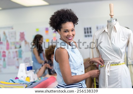 Portrait of female fashion designer at work