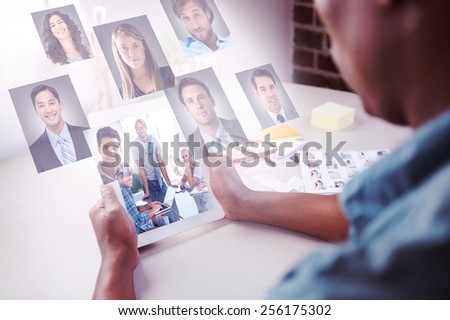 Team having meeting and smiling at camera against profile pictures