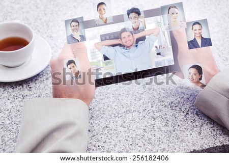 Cheerful creative business employee resting against profile pictures