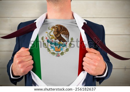 Businessman opening shirt to reveal mexico flag against bleached wooden planks background