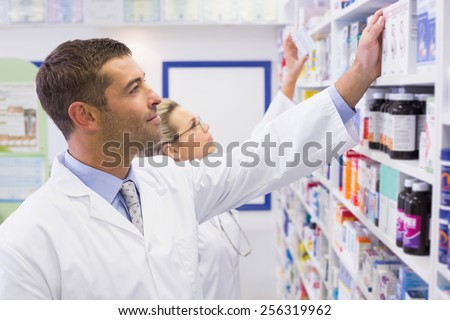 Team of pharmacists looking at medicine at the hospital pharmacy
