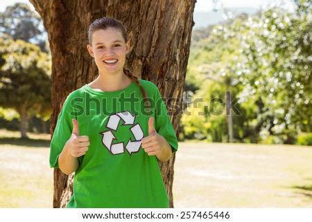 Environmental activist showing thumbs up on a sunny day