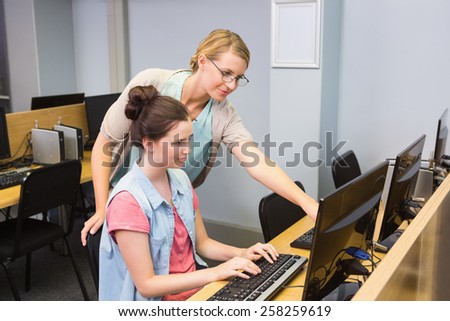 Students working on computer together at the university