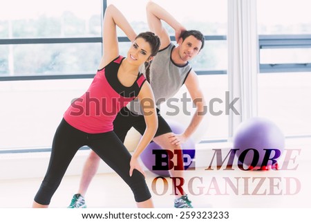 Two people doing power fitness exercise at yoga class against be more organised
