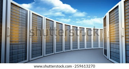Server towers against bright blue sky with clouds