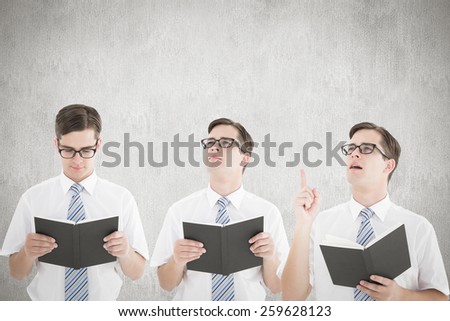 Nerd reading book against white and grey background
