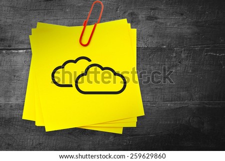 Clouds graphic against sticky note with red paperclip