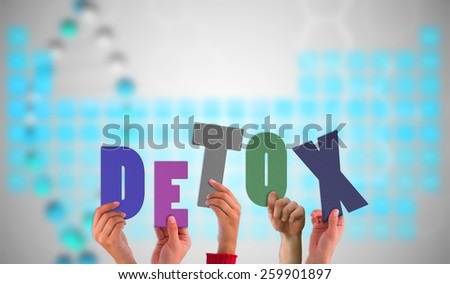 Hands holding up detox against blue periodic tablet with dna strand