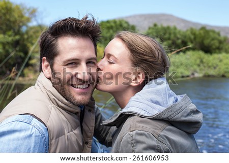Happy couple at a lake in the countryside