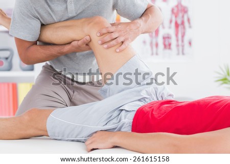 Man having leg massage in medical office