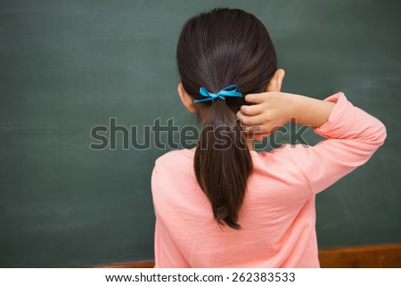 Pupil looking at board at elementary school