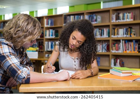 Students studying together in the library at the university