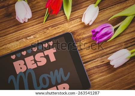 best mom ever against tulips on desk